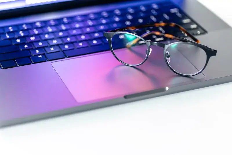Eyeglasses on laptop keyboard